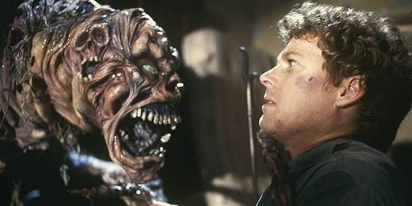 Arthur Cobb (William Katt) nervously stares down the grotesque demon lunging at him.