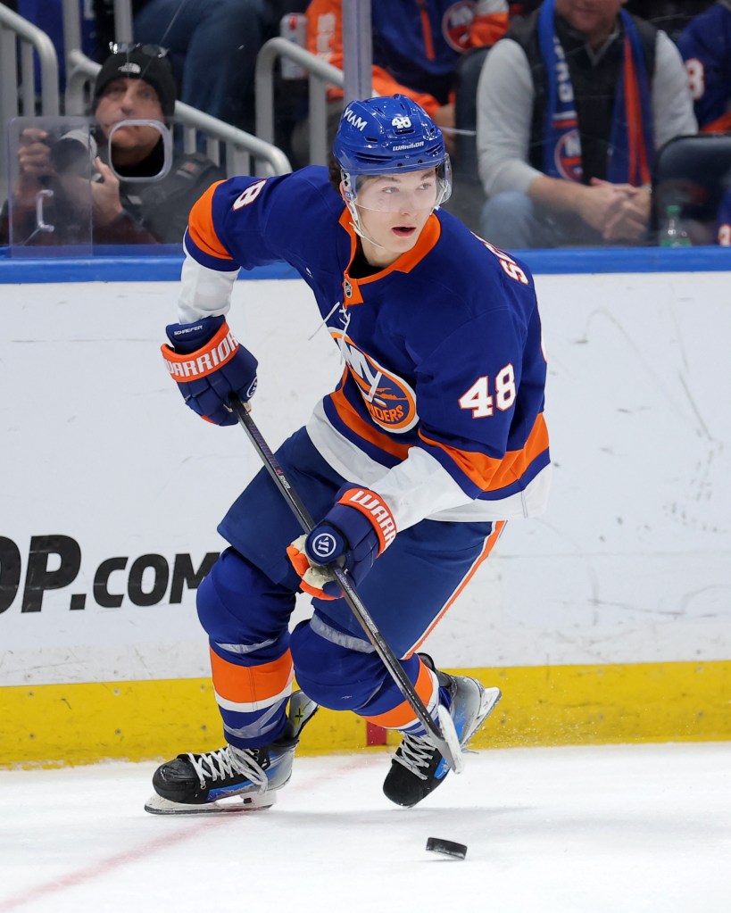 New York Islanders defenseman Matthew Schaefer (48) skates with the puck.