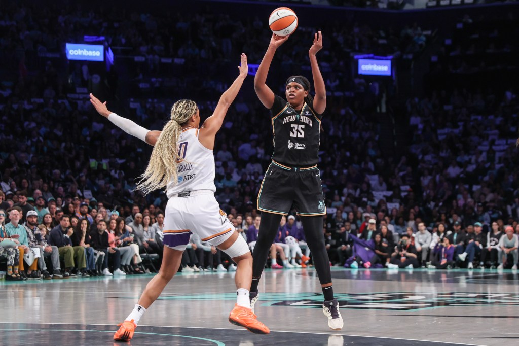 New York Liberty center Jonquel Jones (35) shoots past Phoenix Mercury forward Satou Sabally (0) during the 2025 WNBA Playoffs.