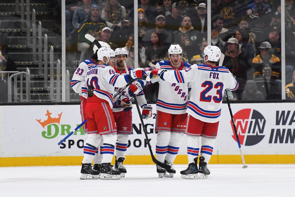 New York Rangers players celebrate a second-period goal.