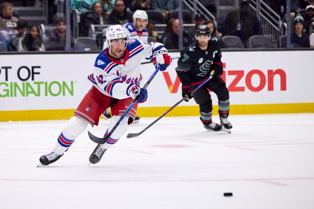 New York Rangers center Noah Laba (42) plays the puck and looks to pass during the first period against the Seattle Kraken at Climate Pledge Arena.