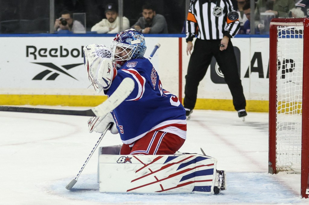 Igor Sheterkin makes a save during the Rangers' loss to the Lightning.