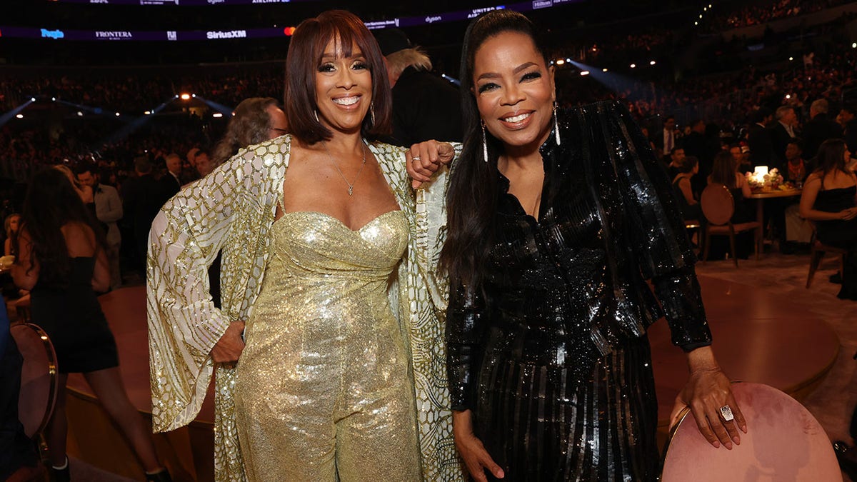 Gayle King and Oprah Winfrey smiling at an event