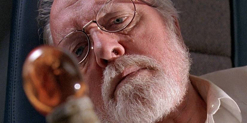 John Hammond (Richard Attenborough) stares sadly at his amber cane in Jurassic Park