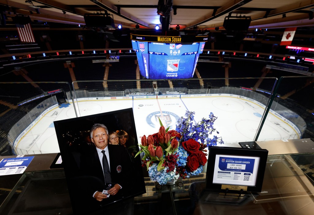 A portrait of Hall of Fame Hockey writer Larry Brooks sits in his desk spot in the press box before the Rangers' game against the Red Wings on Nov. 16, 2025.