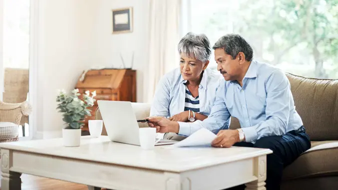 Shot of a senior couple using a laptop together at home.