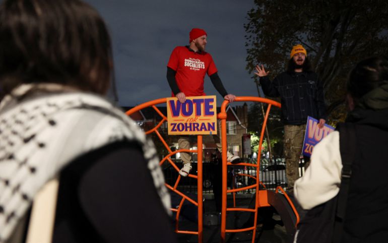 Attendees hold signs that read "vote for Zohran" at a campaign rally held by Democratic candidate for New York City mayor, Zohran Mamdani, on the eve of election day, in the Queens borough of New York City, U.S., November 3, 2025. REUTERS/Shannon Stapleton