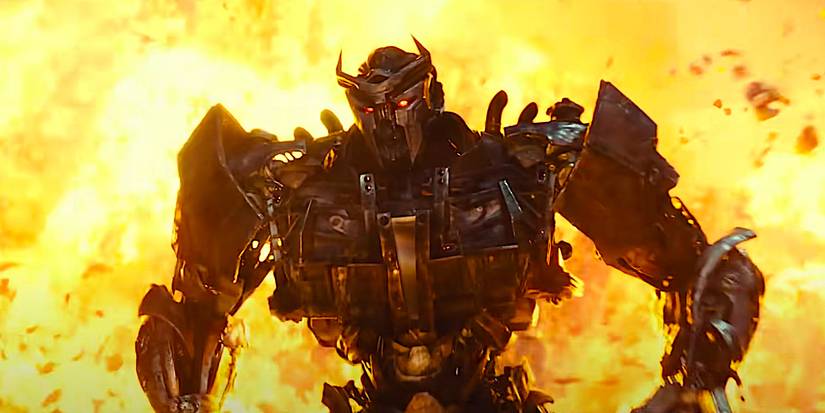Scourge in front of an explosion in Transformers: Rise of the Beasts