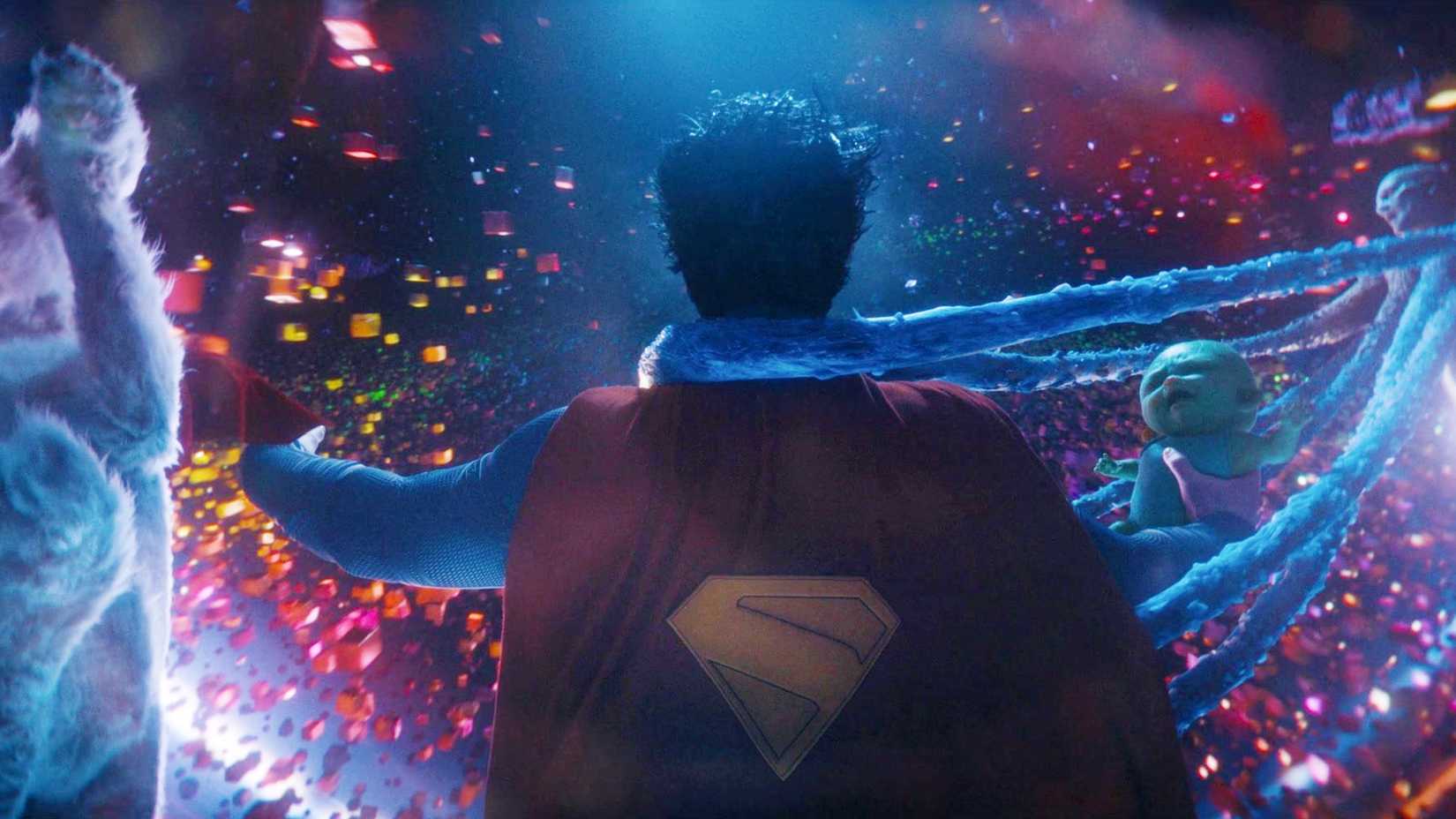 Superman, Krypto, Joey and Metamorpho in front of a black hole in an anti-proton river in Superman 2025