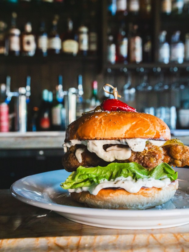 The fried chicken sandwich with lemon garlic labneh and harissa honey, on the brunch menu at Little Fawn Restaurant & Cocktail in Oceanside. (Alex Malik)