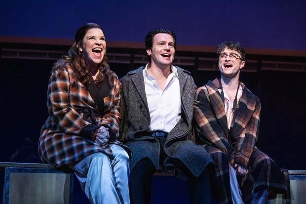 Lindsay Mendez, left, Jonathan Groff and Daniel Radcliffe in "Merrily We Roll Along" on Broadway. A live-capture film version of the show arrives on cinema screens Dec. 5. (Matthew Murphy)