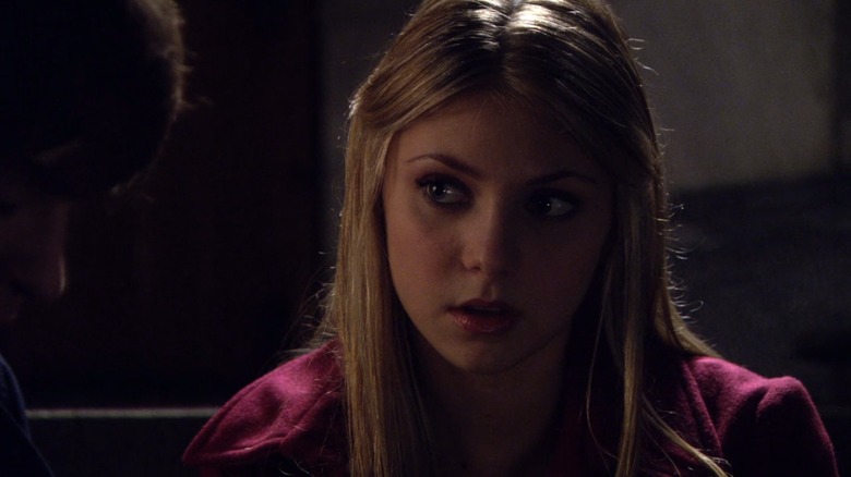Taylor Momsen as Jenny Humphrey on Gossip Girl, sitting outside at night