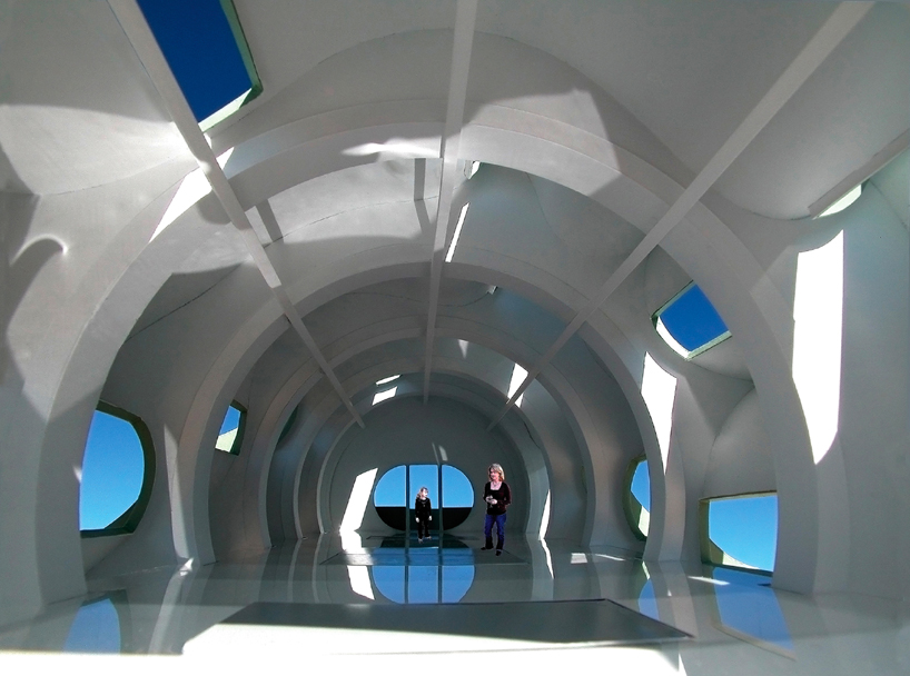 five rotating modules reconfigure to form interactive segmented house of the future