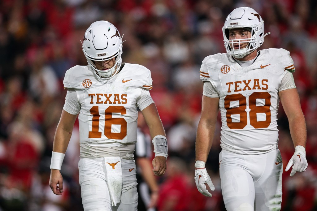 Texas quarterback Arch Manning (16) and tight end Jack Endries (88) reacting during the first half of a college football game against Georgia.