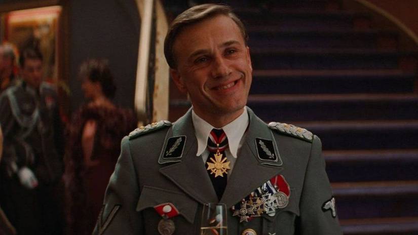 Christoph Waltz smiling as Hans Landa in Inglourious Basterds