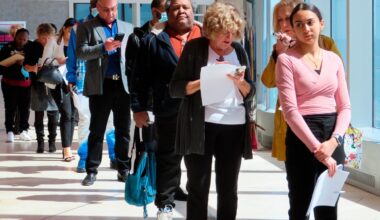 Fewer Americans sought unemployment benefits last week as job cuts stay low