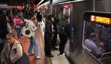 Firefighters free person stuck under E Line train