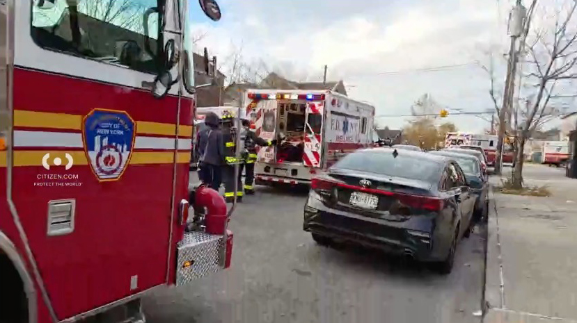A fire truck and ambulance at the scene of a fire in Queens, NY.