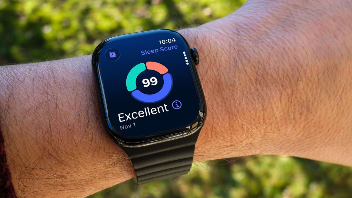 An Apple Watch on a wrist, displaying the Sleep app and a Sleep Score of 99.