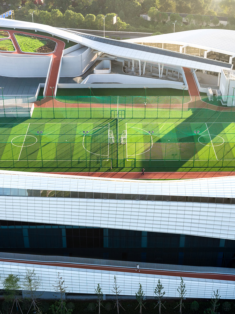 line+ wraps mixed-use sports mall's undulating facade in perforated aluminum panels