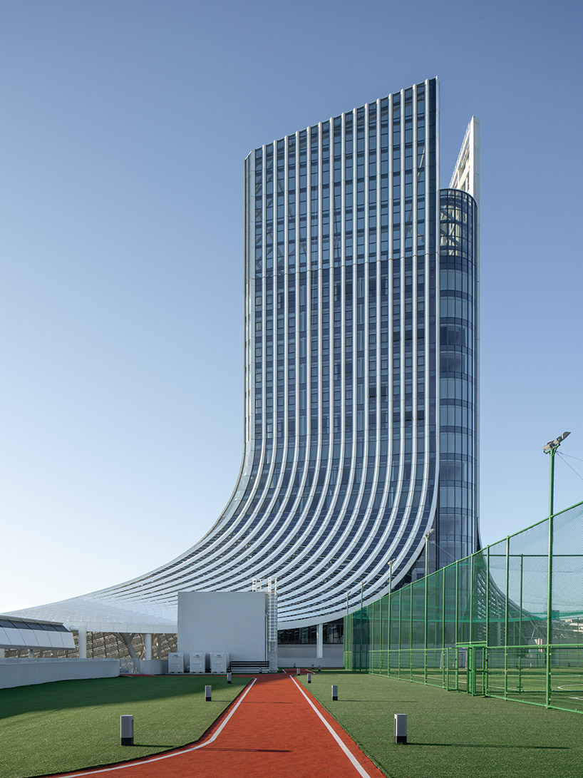 line+ wraps mixed-use sports mall's undulating facade in perforated aluminum panels