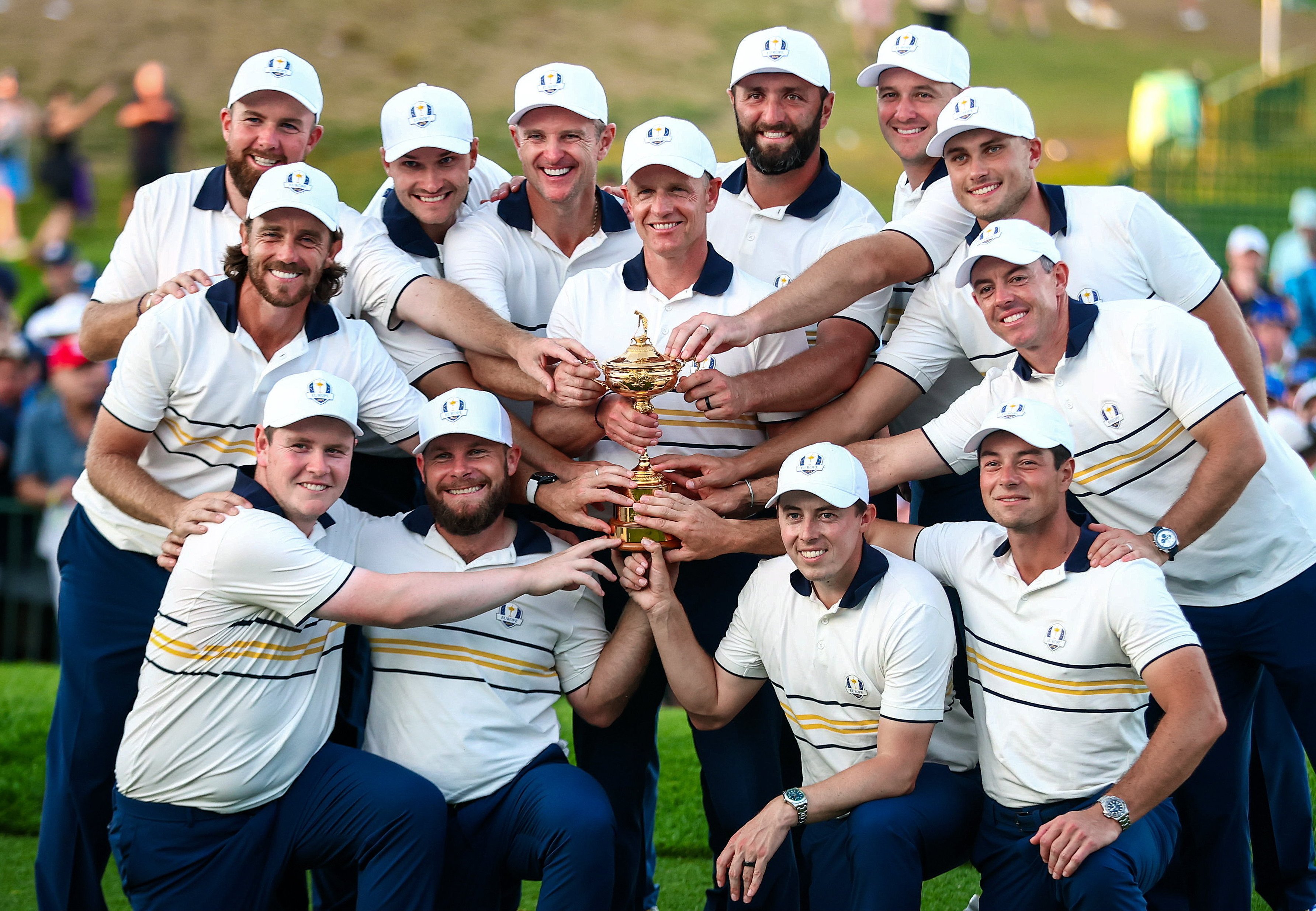 The Europe team and captain Luke Donald celebrate with the Ryder Cup.