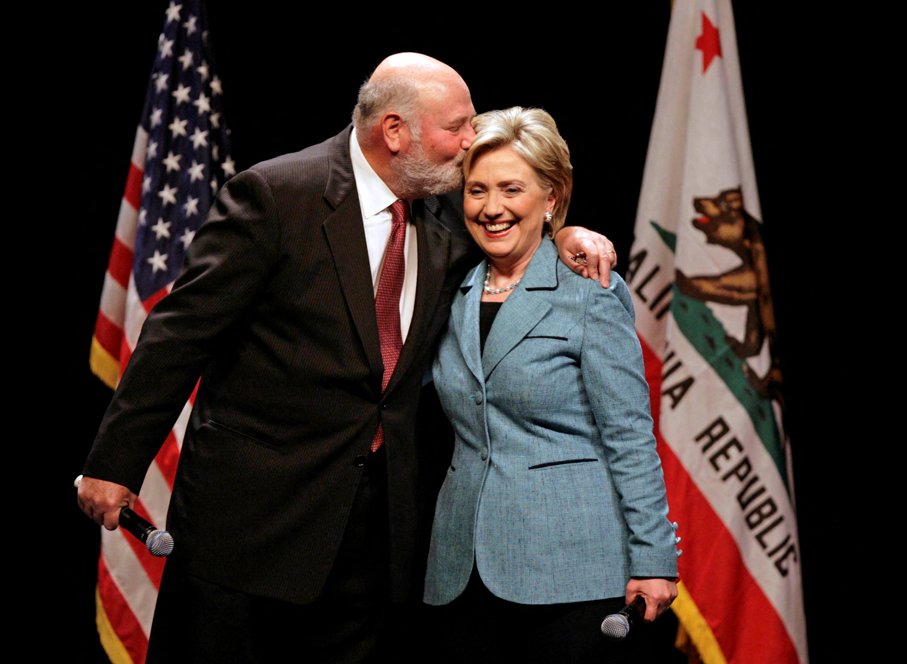 Rob Reiner kissing Hillary Clinton on her forehead at a Beverly Hills fundraiser.