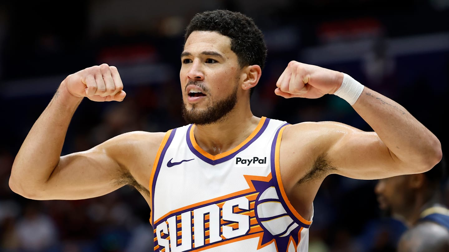 Phoenix Suns guard Devin Booker flexes during a game against the New Orleans Pelicans.