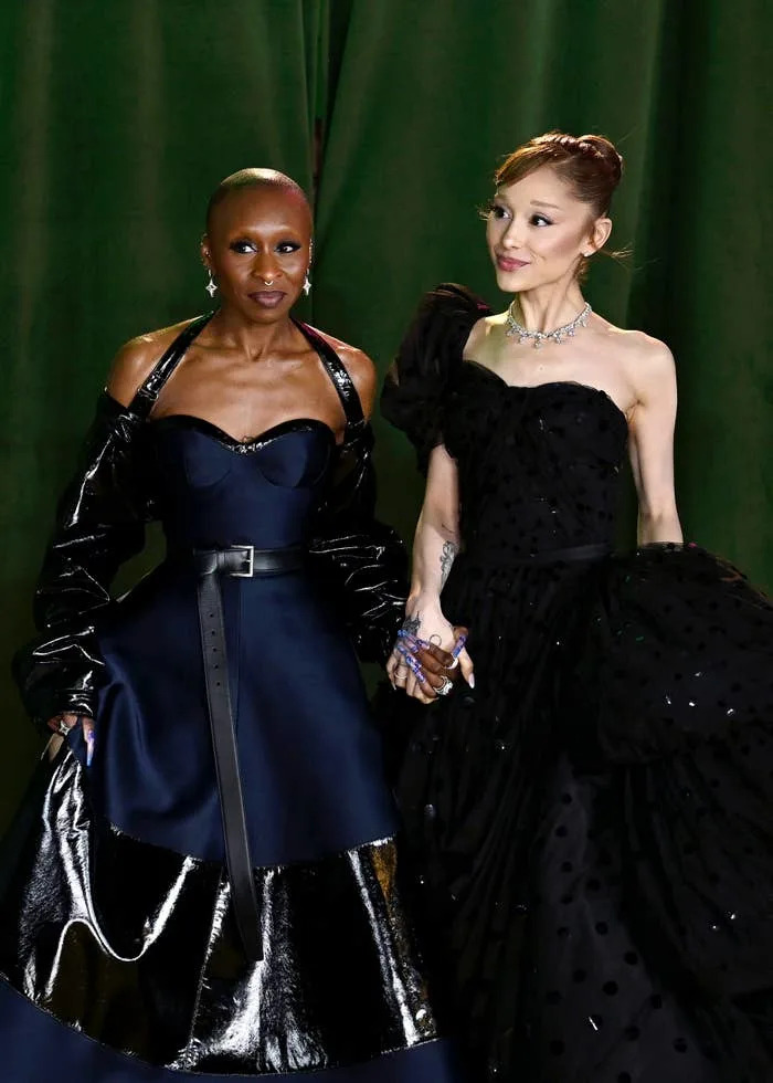 Cynthia Erivo and Ariana Grande holding hands