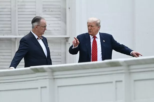 US President Donald Trump, alongside architect James C. McCrery, who reports suggest has taken a step back from the project
