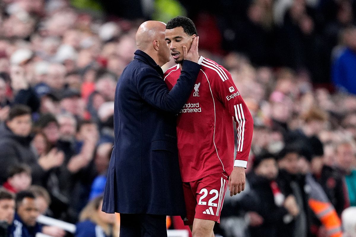 Liverpool manager Arne Slot (left) embraces Hugo Ekitike after he is substituted during the Premier League match at Anfield, Liverpool