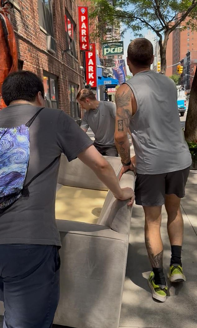 The timing of the cancer was terrible - I'd been due to move apartments. Pictured: I was fresh out of surgery and unable to lift heavy items, so I recruited the help of friends to move a sofa into my new home