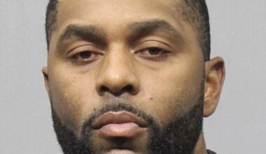 Sherrone Moore's haunting mugshot was released by police for the first time Wednesday