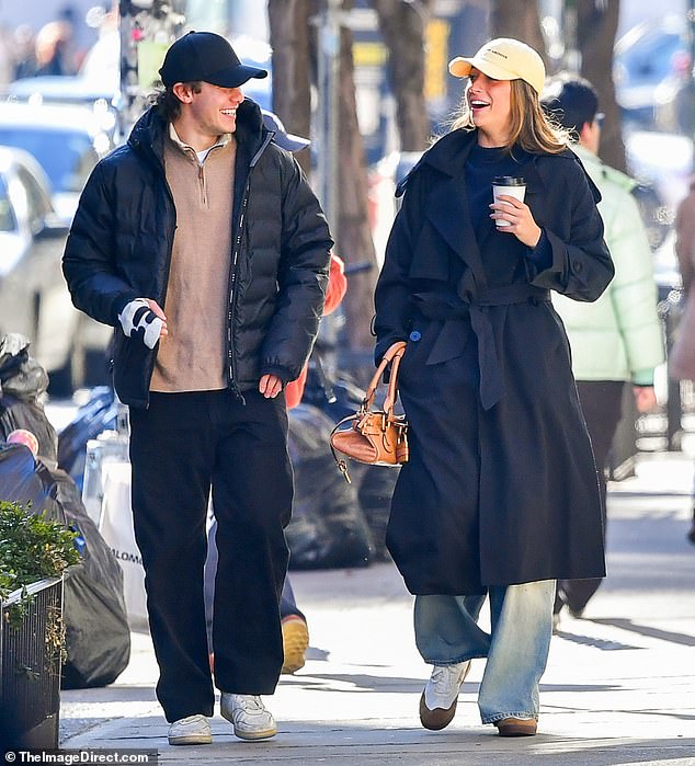 The singer, 22, and the American ice hockey player, 24, were all smiles as they strolled through the city together