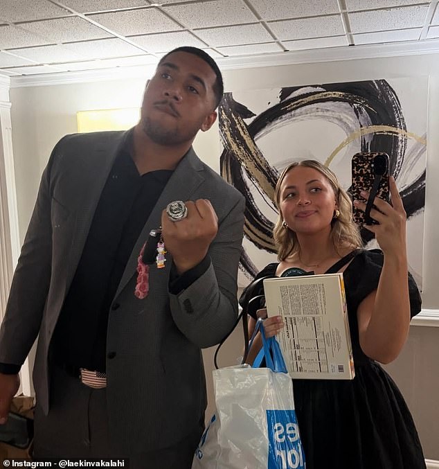 Laekin Vakalahi holds up his Super Bowl ring alongside his now-wife, Sarah