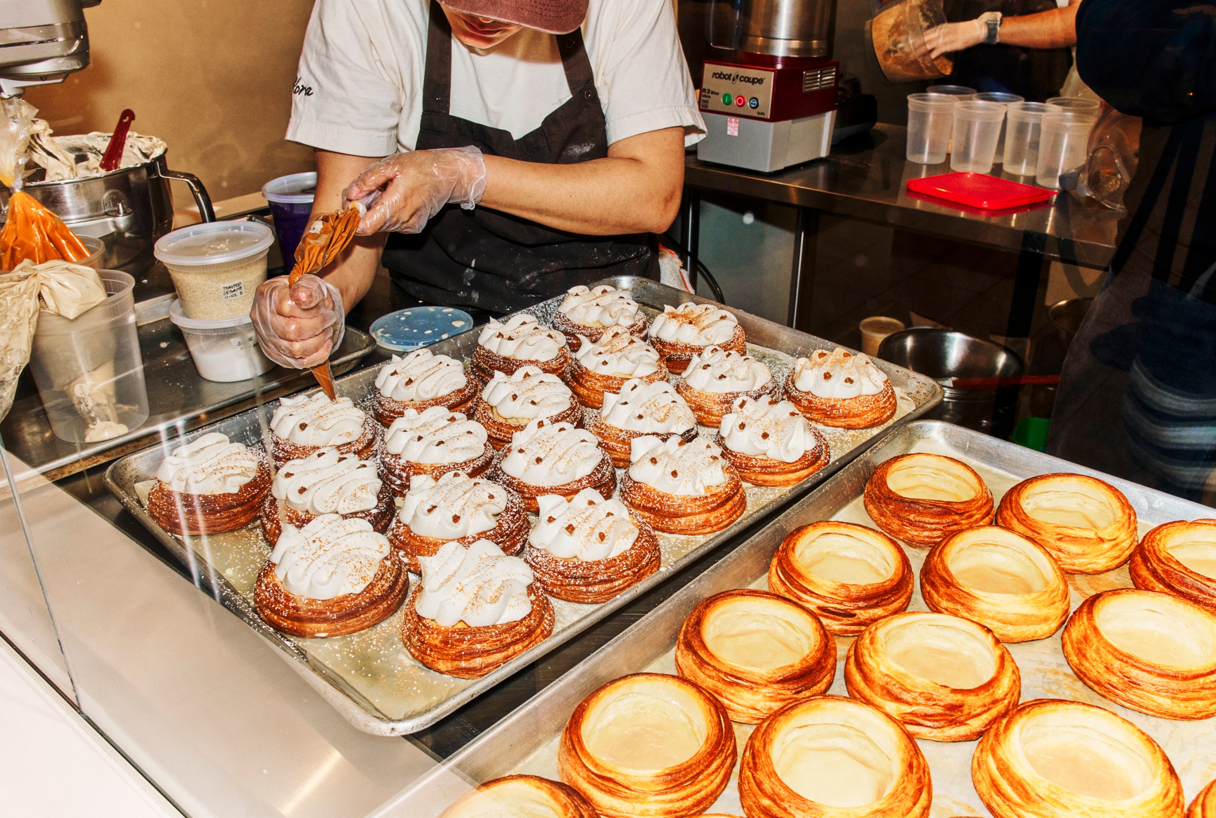 Baking sheets full of beautiful pastries are prepped at Kora.