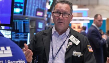 Wall Street pulls back from its record heights