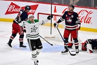 Dallas Stars' Roope Hintz (24) celebrates a goal by teammate Jason Robertson against the...