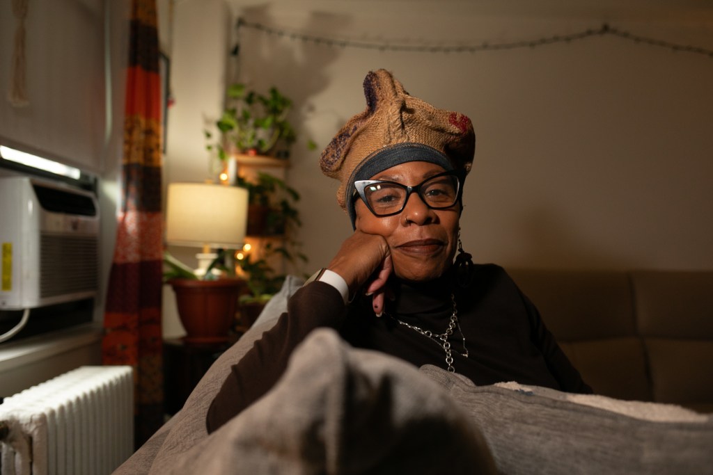 East New York NYCHA resident Yolanda Moore poses for a portrait in her Boulevard Houses apartment.