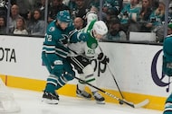Dallas Stars center Wyatt Johnston (53) reaches for the puck against San Jose Sharks left...
