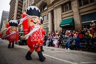 Nutcracker inflatables walk through the parade during the Dallas Holiday Parade on Saturday,...