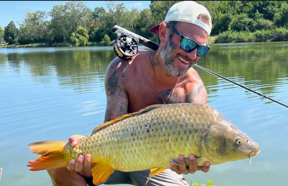 Patrik Berger after catching a fish