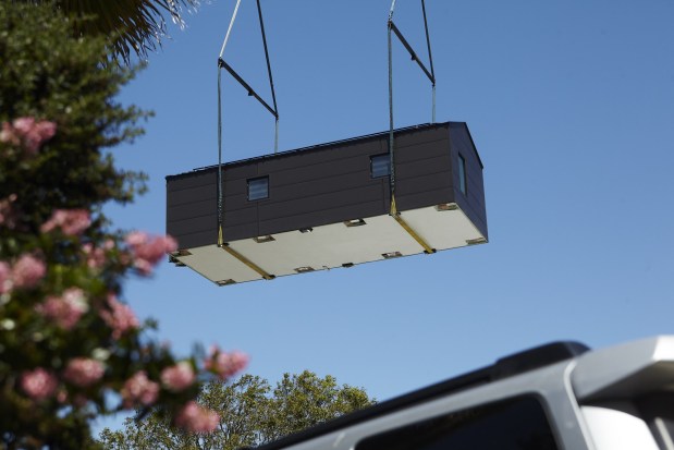 A Samara prefab home being lowered by a crane. (Courtesy of Samara)