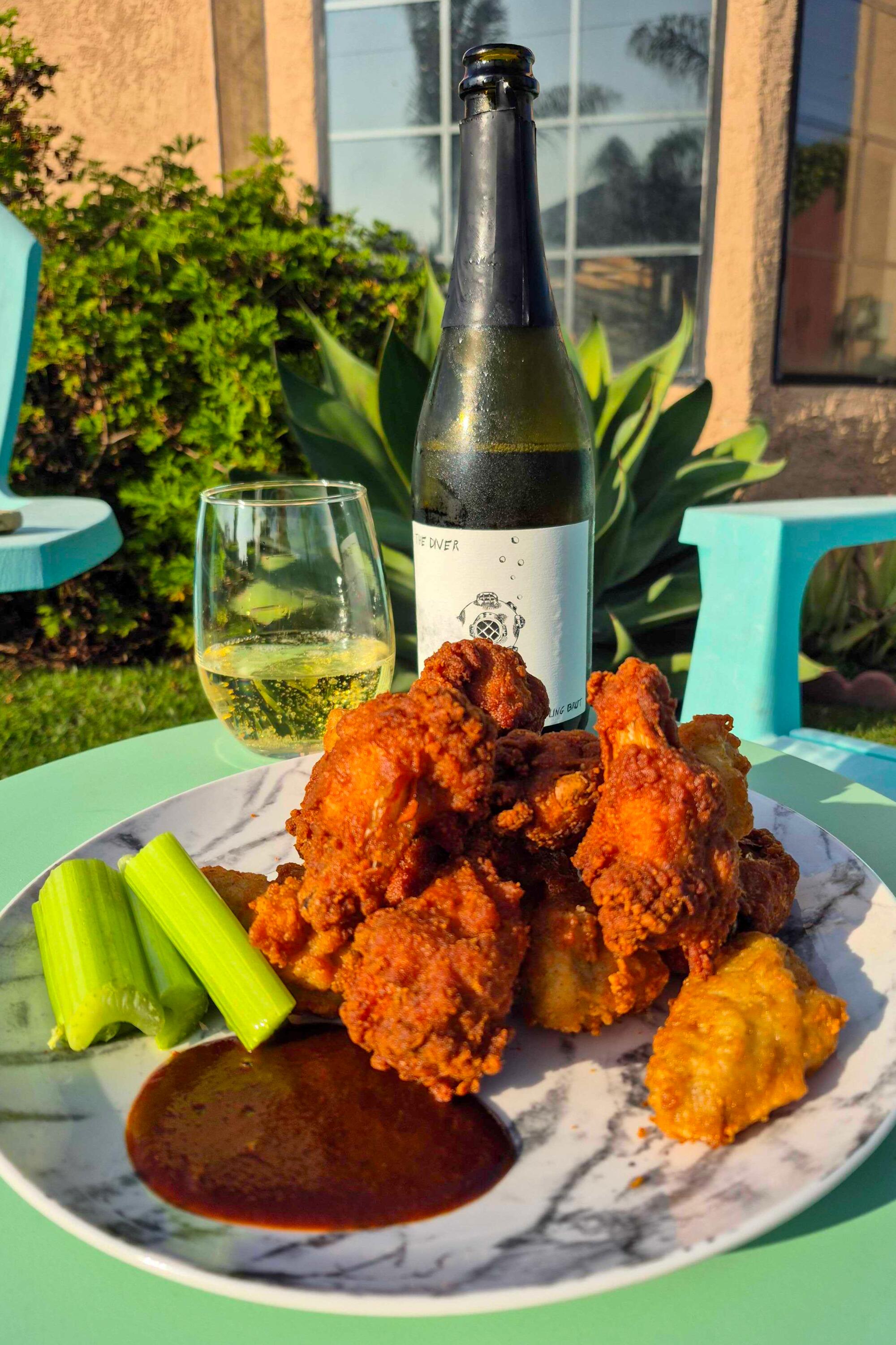 Fried chicken wings from Albertsons on Crenshaw Boulevard and The Diver sparkling brut from Triangle Wines.