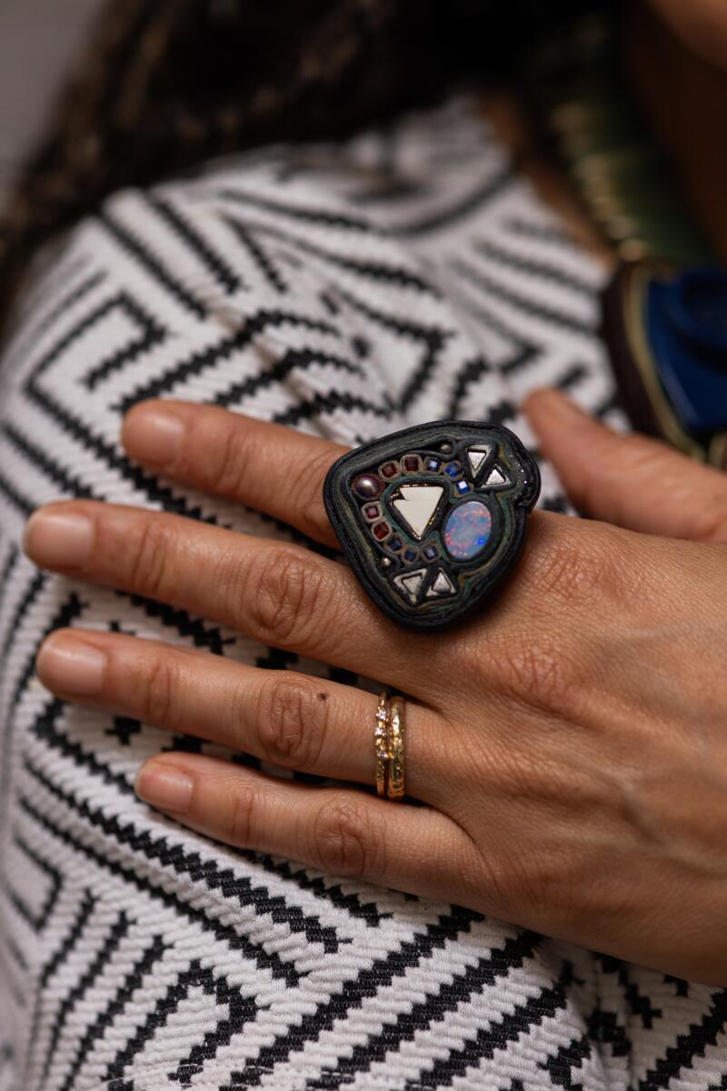 Alicia Piller displays her handmade ring.