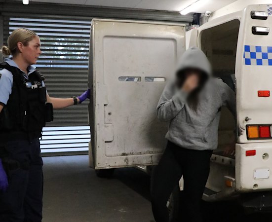 Woman charged after more than 30 gunshots fired at Sydney home