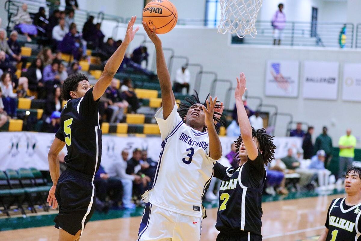 Brentwood guard AJ Okoh drives for a layup on his way to MVP honors.