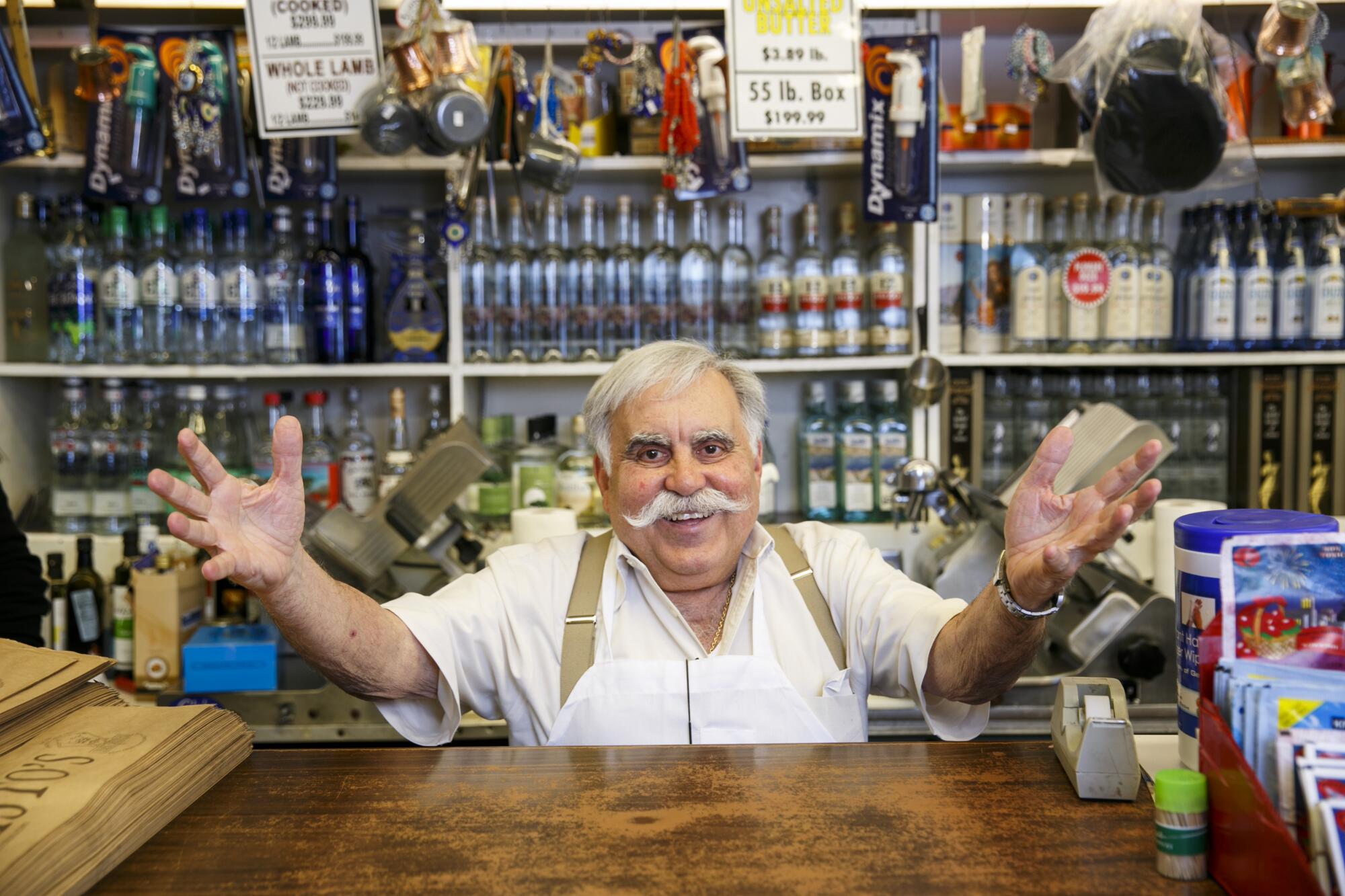 Chrys Chrys, owner of Papa Cristo's, does his signature pose behind the counter in 2016.