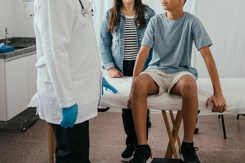 Getty Stock image of teenager at the doctor's office.