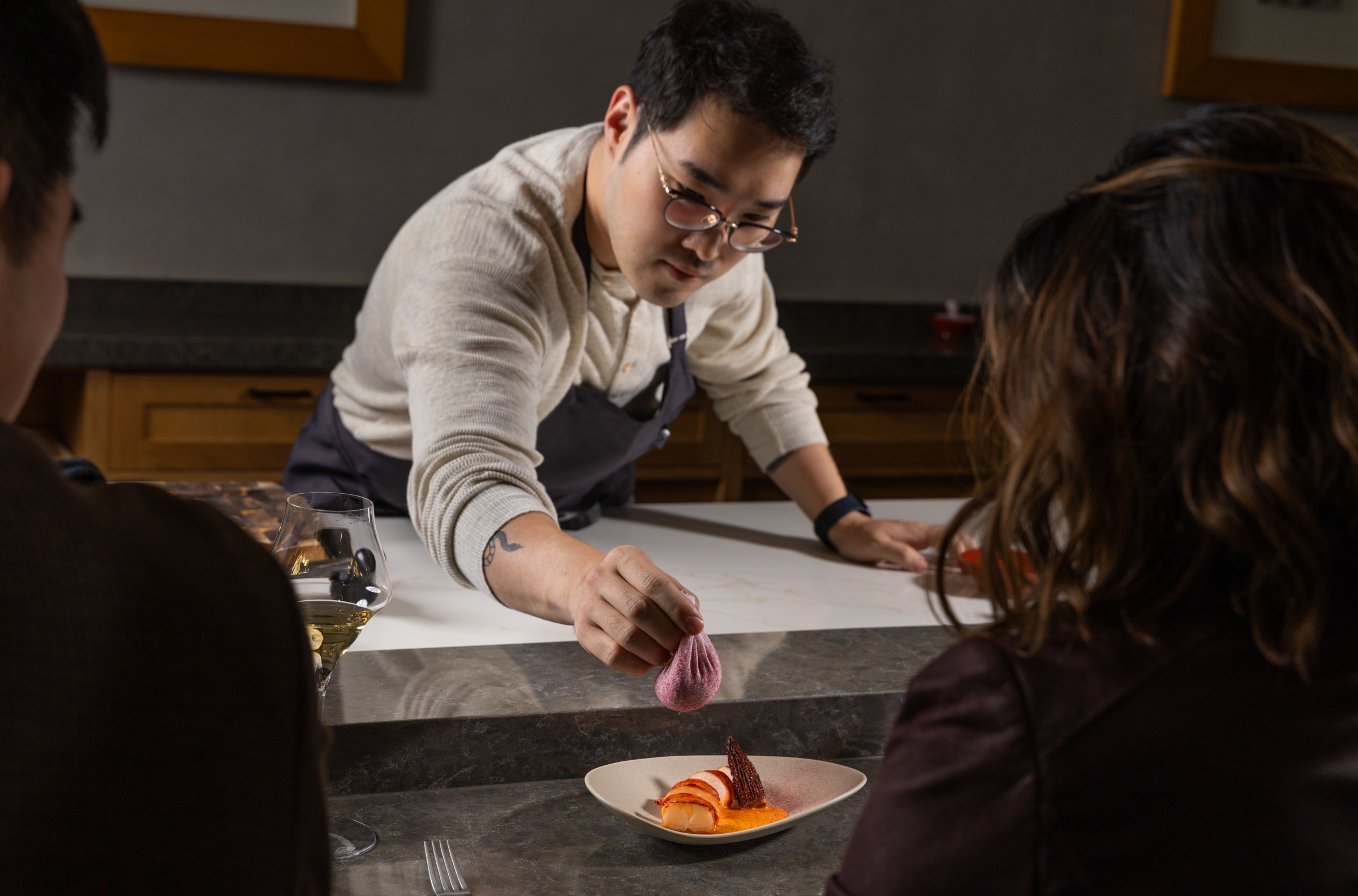 Ki Kim dusting lobster with raspberry powder at Restaurant Ki.